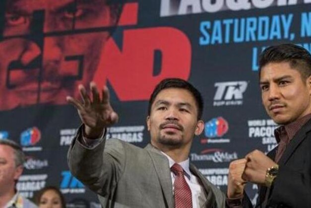 Manny Pacquiao, left, and Jessie Vargas poses for photos during a news conference in Beverly Hills, Calif., on Thursday, Sept. 8, 2016., about their WBO welterweight title fight scheduled for Nov. 5. (AP Photo/Damian Dovarganes)