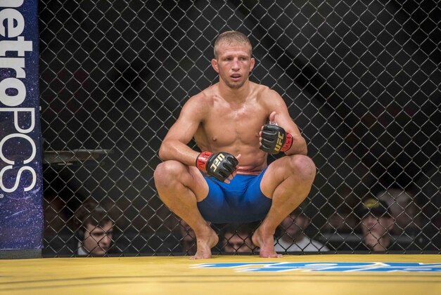 Jul 9, 2016; Las Vegas, NV, USA; TJ Dillashaw (red gloves) reacts after round 2 against Raphael Assuncao during UFC 200 at T-Mobile Arena. Mandatory Credit: Joshua Dahl-USA TODAY Sports