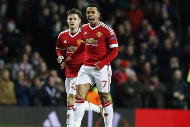 United’s Memphis Depay celebrates after scoring during the Europa League round of 32 second leg soccer match between Manchester United and FC Midtjylland in Manchester, England, Thursday, Feb. 25, 2016 . (AP Photo/Jon Super)