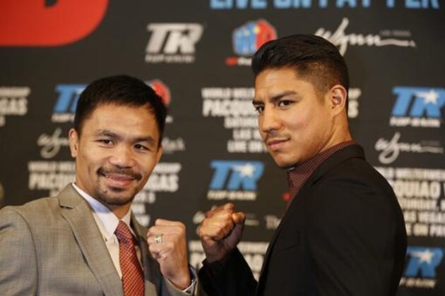 Boxers Manny Pacquiao, left, and Jessie Vargas pose during a news conference in Beverly Hills, Calif., on Thursday, Sept. 8, 2016, about their WBO welterweight title fight scheduled for Nov. 5. (AP Photo/Damian Dovarganes)