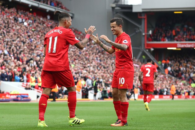 LIVERPOOL, ENGLAND - SEPTEMBER 24:  Philippe Coutinho of Liverpool celebrates with Roberto Firmino of Liverpool  as he scores their fourth goal during the Premier League match between Liverpool and Hull City at Anfield on September 24, 2016 in Liverpool, England.  (Photo by Julian Finney/Getty Images)