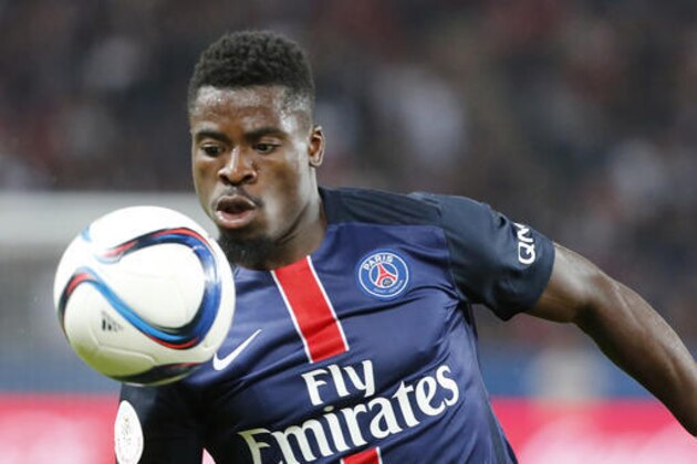 FILE - In this Aug.16, 2015 file photo, Paris Saint Germain's Serge Aurier watches the ball during the French League one soccer match between Paris Saint Germain and Ajaccio Gazelec, at the Parc des Princes stadium in Paris. Paris Saint-Germain defender Aurier has been sentenced to two months in prison for assaulting a police officer. The Ivory Coast player was arrested near the Champs-Elysees in May following an argument with police after a night out in Paris. (AP Photo/Jacques Brinon, File)
