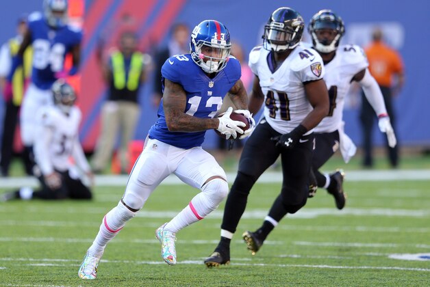 Oct 16, 2016; East Rutherford, NJ, USA; New York Giants wide receiver Odell Beckham Jr. (13) runs past Baltimore Ravens defensive back Anthony Levine (41) for a touchdown during the fourth quarter at MetLife Stadium. Mandatory Credit: Brad Penner-USA TODAY Sports