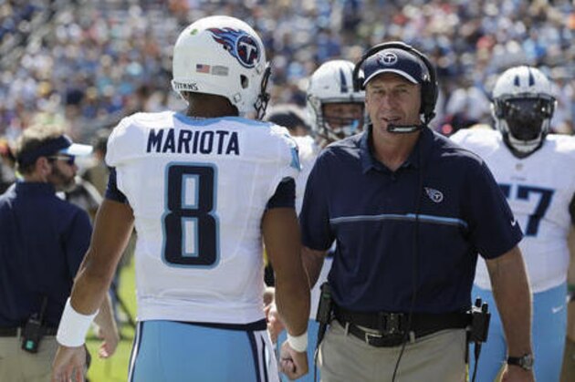 FILE - In this Sept. 25, 2016, file photo, Tennessee Titans quarterback Marcus Mariota (8) walks past head coach Mike Mularkey before an NFL football game between the Titans and the Oakland Raiders, in Nashville, Tenn. The Tennessee Titans finally ended one skid to the Chargers the last time these teams met in 2013. Now the Titans head to San Diego on Sunday trying to end a losing streak in a place this franchise has lost six straight with the last win all the way back in 1990.  (AP Photo/James Kenney, File)