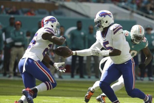 Buffalo Bills quarterback Tyrod Taylor (5) hands the ball to running back LeSean McCoy (25), during the first half of an NFL football game against the Miami Dolphins, Sunday, Oct. 23, 2016, in Miami Gardens, Fla. (AP Photo/Lynne Sladky)