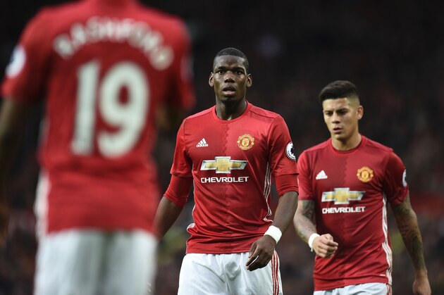Manchester United's French midfielder Paul Pogba (c) reacts during the English Premier League football match between Manchester United and Burnley at Old Trafford in Manchester, north west England, on October 29, 2016. / AFP / OLI SCARFF / RESTRICTED TO EDITORIAL USE. No use with unauthorized audio, video, data, fixture lists, club/league logos or 'live' services. Online in-match use limited to 75 images, no video emulation. No use in betting, games or single club/league/player publications.  /         (Photo credit should read OLI SCARFF/AFP/Getty Images)