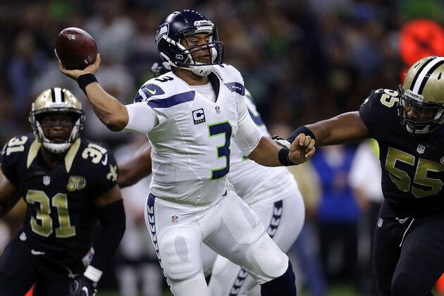 NEW ORLEANS, LA - OCTOBER 30: Russell Wilson #3 of the Seattle Seahawks throws the ball as Darryl Tapp #55 of the New Orleans Saints defends during the second half of a game at the Mercedes-Benz Superdome on October 30, 2016 in New Orleans, Louisiana.  (Photo by Jonathan Bachman/Getty Images)