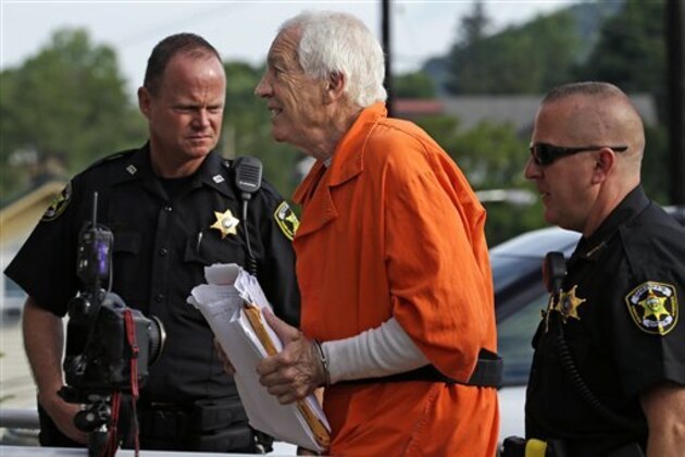 Former Penn State University assistant football coach Jerry Sandusky, center, arrives at the Centre County Courthouse for an appeals hearing about whether he was improperly convicted four years ago, in Bellefonte, Pa. Friday, Aug. 12, 2016. (AP Photo/Gene J. Puskar)