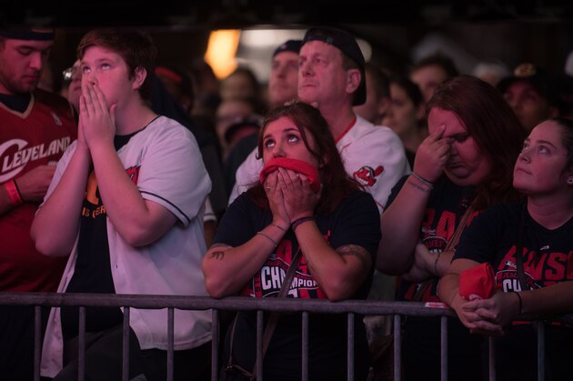 CLEVELAND, OH - NOVEMBER 03: Fans react as they watch a big screen outside of Progressive Field during game 7 of the World Series between the Cleveland Indians and the Chicago Cubs in the early morning hours on November 3, 2016 in Cleveland, Ohio. The Cubs defeated the Indians 8-7 in 10 innings to win their first World Series championship in 108 years. (Photo by Justin Merriman/Getty Images)
