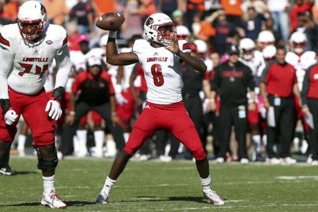 Louisville quarterback Lamar Jackson (8) throws a touchdown during the first half of an NCAA college football game on Saturday, Oct. 29, 2016 in Charlottesville, Va. Louisville defeated Virginia 32-25. (AP Photo/Ryan M. Kelly)