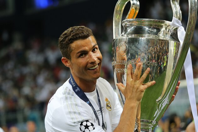 MILAN, ITALY - MAY 28:  Cristiano Ronaldo of Real Madrid celebrates with the trophy following his team's victory in a penalty shootout during the UEFA Champions League final match between Real Madrid and Club Atletico de Madrid at Stadio Giuseppe Meazza on May 28, 2016 in Milan, Italy.  (Photo by Matthew Ashton - AMA/Getty Images)