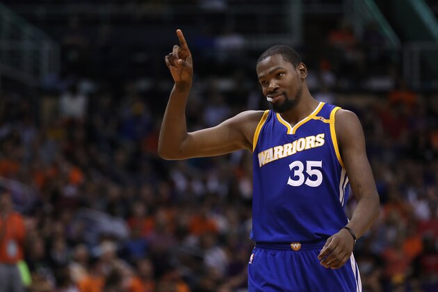 PHOENIX, AZ - OCTOBER 30:  Kevin Durant #35 of the Golden State Warriors reacts after scoring against the Phoenix Suns during the second half of the NBA game at Talking Stick Resort Arena on October 30, 2016 in Phoenix, Arizona.  The Warriors defeated the Suns 106 -100. NOTE TO USER: User expressly acknowledges and agrees that, by downloading and or using this photograph, User is consenting to the terms and conditions of the Getty Images License Agreement.  (Photo by Christian Petersen/Getty Images)
