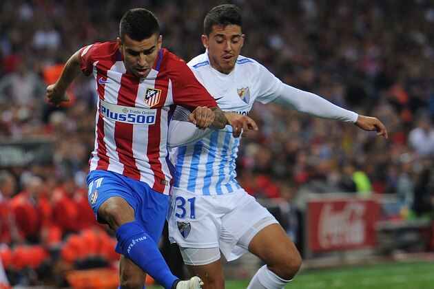MADRID, SPAIN - OCTOBER 29:  Angel Correa of Club Atletico de Madrid is challenged by Pablo Fornals of Malaga CF during the La Liga match between Club Atletico de Madrid and Malaga CF at estadio Vicente Calderono n October 29, 2016 in Madrid, Spain.  (Photo by Denis Doyle/Getty Images)