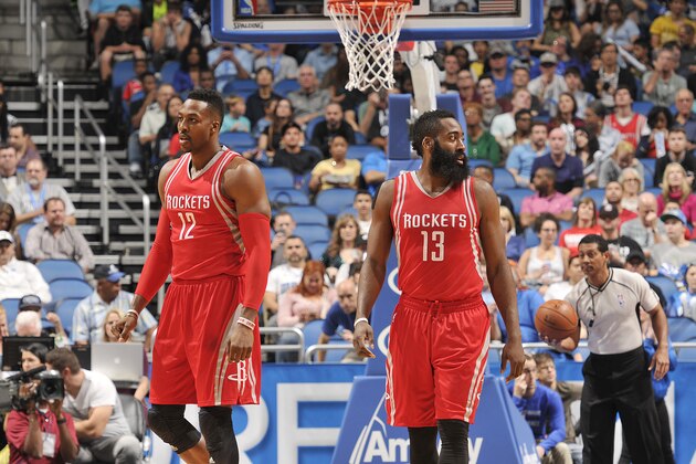 ORLANDO, FL - DECEMBER 23:  Dwight Howard #12 of the Houston Rockets and James Harden #13 of the Houston Rockets stand on the court against the Orlando Magic on December 23, 2015 at Amway Center in Orlando, Florida. NOTE TO USER: User expressly acknowledges and agrees that, by downloading and or using this photograph, User is consenting to the terms and conditions of the Getty Images License Agreement. Mandatory Copyright Notice: Copyright 2015 NBAE (Photo by Fernando Medina/NBAE via Getty Images)