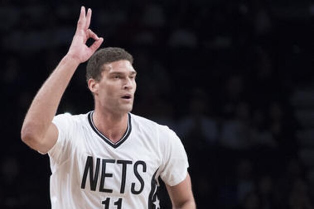 Brooklyn Nets center Brook Lopez gestures after scoring a 3-point goal in during the first half of an NBA basketball game against the Charlotte Hornets, Friday, Nov. 4, 2016, in New York. (AP Photo/Mary Altaffer)