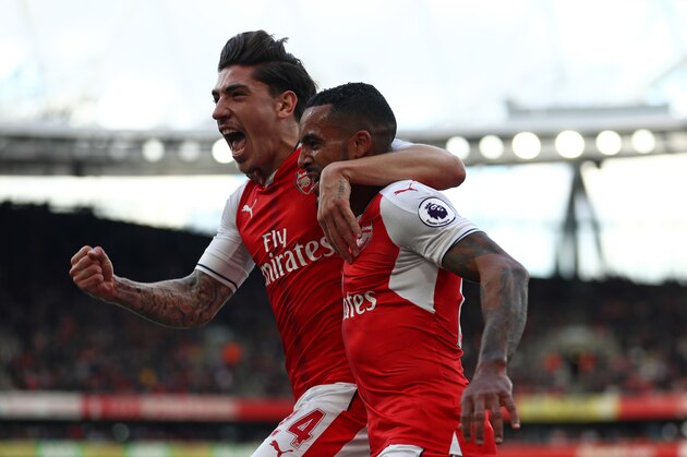 LONDON, ENGLAND - OCTOBER 15: Theo Walcott of Arsenal (R) celebrates scoring his sides first goal with team mate Hector Bellerin of Arsenal (L) during the Premier League match between Arsenal and Swansea City at Emirates Stadium on October 15, 2016 in London, England.  (Photo by Julian Finney/Getty Images)