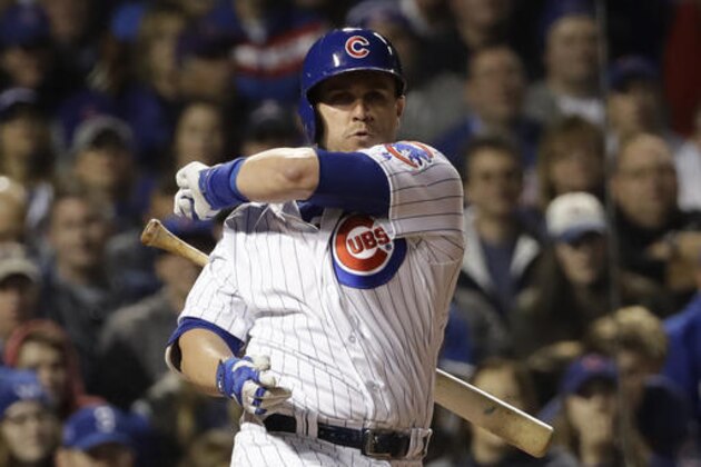 Chicago Cubs' Miguel Montero loses his bat swinging during the fifth inning of Game 3 of the Major League Baseball World Series against the Cleveland Indians Friday, Oct. 28, 2016, in Chicago. (AP Photo/David J. Phillip)