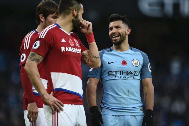 Middlesbrough's Spanish striker Alvaro Negredo (2L) and Manchester City's Argentinian striker Sergio Aguero (R) share a joke during the English Premier League football match between Manchester City and Middlesbrough at the Etihad Stadium in Manchester, north west England, on November 5, 2016. / AFP / OLI SCARFF / RESTRICTED TO EDITORIAL USE. No use with unauthorized audio, video, data, fixture lists, club/league logos or 'live' services. Online in-match use limited to 75 images, no video emulation. No use in betting, games or single club/league/player publications.  /         (Photo credit should read OLI SCARFF/AFP/Getty Images)