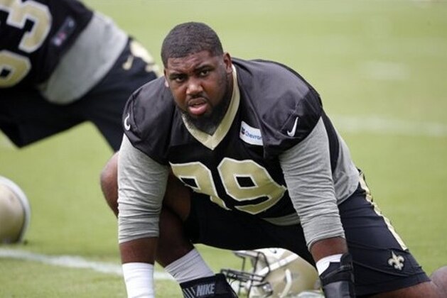 New Orleans Saints defensive tackle Sheldon Rankins (99) stretches during the NFL football team's minicamp in Metairie, La., Tuesday, June 14, 2016. (AP Photo/Gerald Herbert)