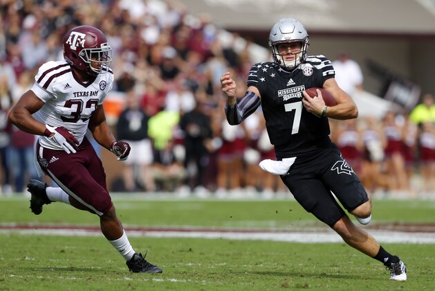 STARKVILLE, MS - NOVEMBER 5:  Quarterback Nick Fitzgerald #7 of the Mississippi State Bulldogs scrambles for a first down as he gets around linebacker Shaan Washington #33 of the Texas A&M Aggies during the first half of an NCAA college football game at Davis Wade Stadium on November 5, 2016 in Starkville, Mississippi. (Photo by Butch Dill/Getty Images)