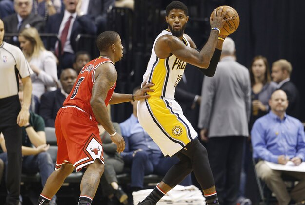 Nov 5, 2016; Indianapolis, IN, USA; Indiana Pacers forward Paul George (13) is guarded by Chicago Bulls guard Isaiah Canaan (0) at Bankers Life Fieldhouse. Mandatory Credit: Brian Spurlock-USA TODAY Sports