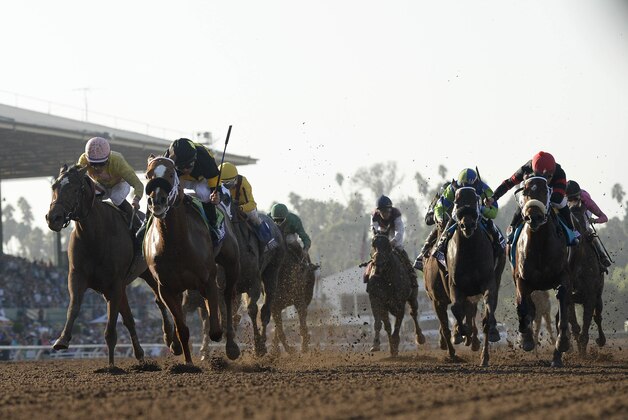 Nov 5, 2016; Santa Anita, CA, USA; Mike Smith aboard Finest City leads the pack in race nine during the 33rd Breeders Cup world championships at Santa Anita Park. Mandatory Credit: Richard Mackson-USA TODAY Sports