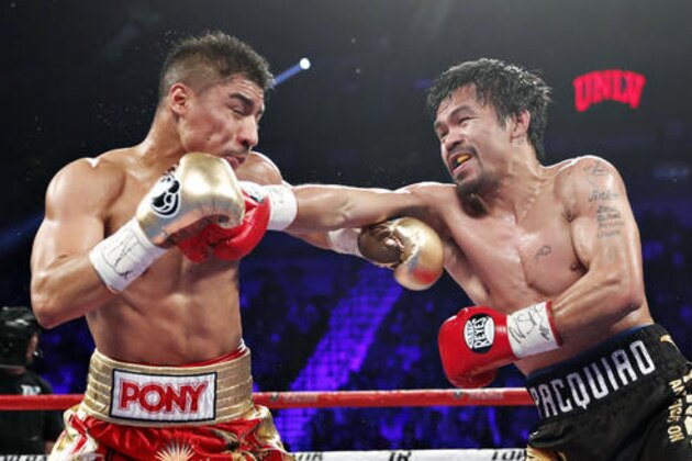 Manny Pacquiao, right, of the Philippines, hits Jessie Vargas during their WBO welterweight title boxing match, Saturday, Nov. 5, 2016, in Las Vegas. (AP Photo/Isaac Brekken)