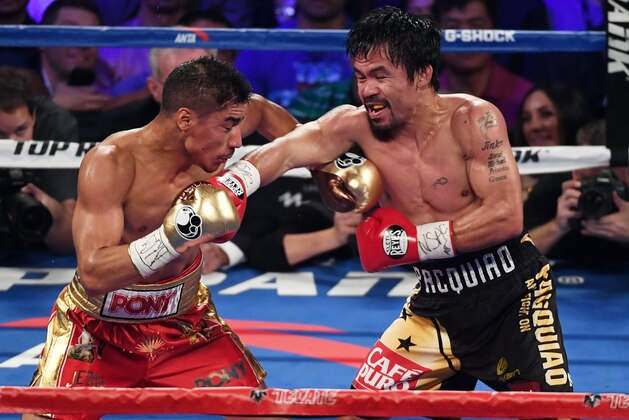 LAS VEGAS, NV - NOVEMBER 05:  Jessie Vargas (L) and Manny Pacquiao battle in the third round of their WBO welterweight championship fight at the Thomas & Mack Center on November 5, 2016 in Las Vegas, Nevada. Pacquiao won by unanimous decision.  (Photo by Ethan Miller/Getty Images)