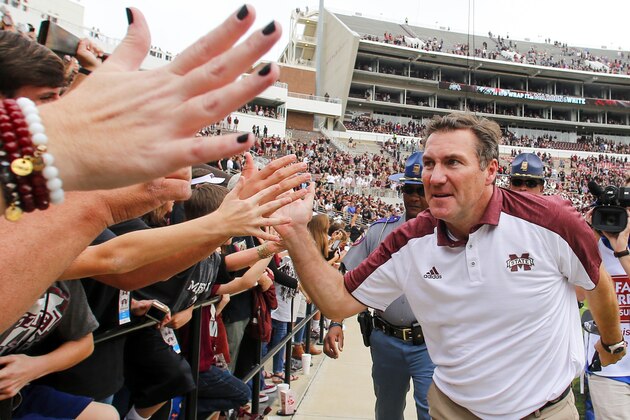STARKVILLE, MS - NOVEMBER 5:  Head coach Dan Mullen of the Mississippi State Bulldogs celebrates with fans after the end of an NCAA college football game at Davis Wade Stadium on November 5, 2016 in Starkville, Mississippi. Mississippi State beat the Texas A&M Aggies 35-28. (Photo by Butch Dill/Getty Images)