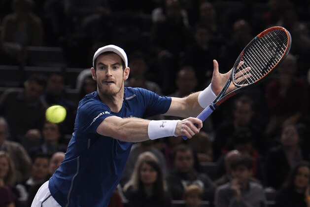 Britain's Andy Murray returns the ball to USA's John Isner during their final tennis match at the ATP World Tour Masters 1000 indoor tournament in Paris on November 6, 2016. / AFP / MIGUEL MEDINA        (Photo credit should read MIGUEL MEDINA/AFP/Getty Images)
