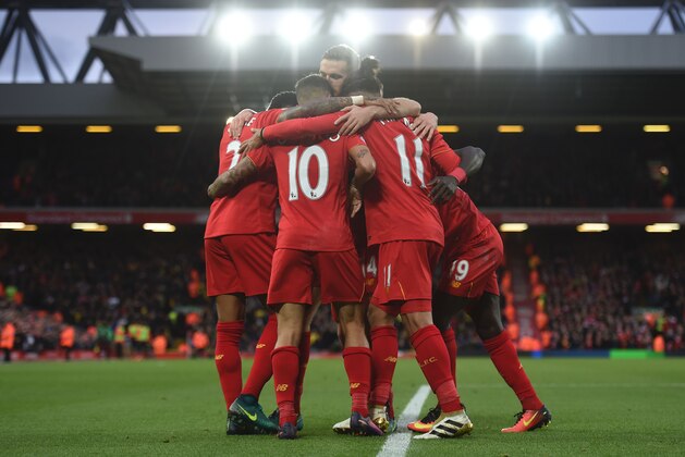 Liverpool's Senegalese midfielder Sadio Mane (R) celebrates scoring his team's fifth goal with Liverpool's Brazilian midfielder Philippe Coutinho (C) and Liverpool's Brazilian midfielder Roberto Firmino (2R) during the English Premier League football match between Liverpool and Watford at Anfield in Liverpool, north west England on November 6, 2016. / AFP / PAUL ELLIS / RESTRICTED TO EDITORIAL USE. No use with unauthorized audio, video, data, fixture lists, club/league logos or 'live' services. Online in-match use limited to 75 images, no video emulation. No use in betting, games or single club/league/player publications.  /         (Photo credit should read PAUL ELLIS/AFP/Getty Images)