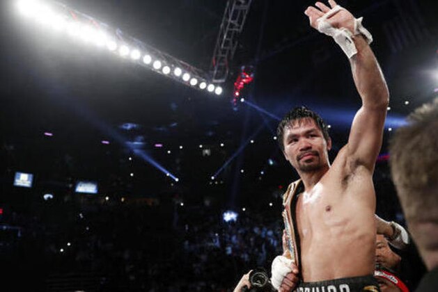Manny Pacquiao, of the Philippines, celebrates after defeating Jessie Vargas in their WBO welterweight title boxing match, Saturday, Nov. 5, 2016, in Las Vegas. (AP Photo/Isaac Brekken)