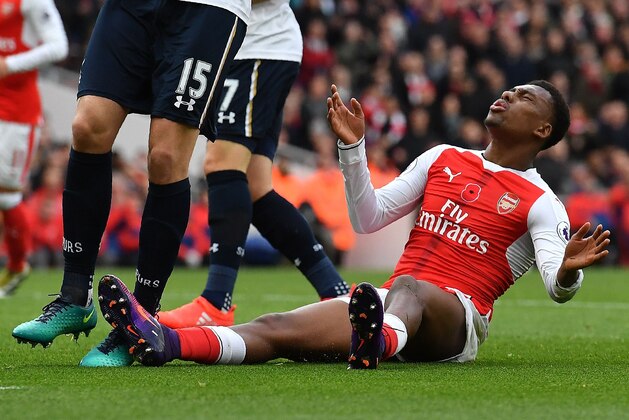 Arsenal's Nigerian striker Alex Iwobi reacts after missing a shot on goal during the English Premier League football match between Arsenal and Tottenham Hotspur at the Emirates Stadium in London on November 6, 2016.  / AFP / BEN STANSALL / RESTRICTED TO EDITORIAL USE. No use with unauthorized audio, video, data, fixture lists, club/league logos or 'live' services. Online in-match use limited to 75 images, no video emulation. No use in betting, games or single club/league/player publications.  /         (Photo credit should read BEN STANSALL/AFP/Getty Images)