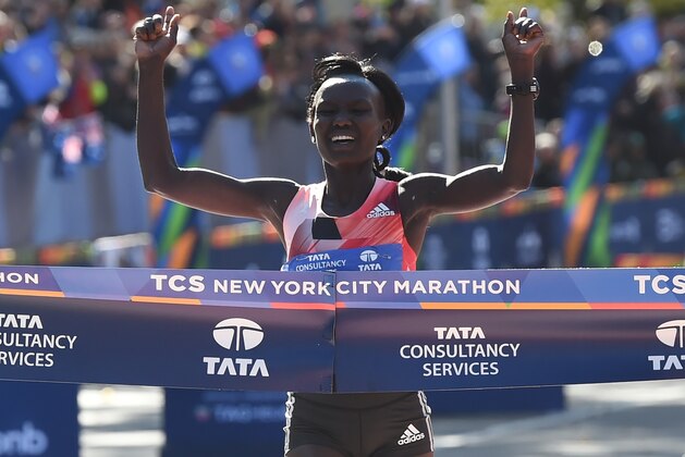 Mary Keitany of Kenya crosses the finish line to win the Women's Division during the 2016 TCS New York City Marathon November 6, 2016 in New York.
The 34-year-old Kenyan defended her title Sunday in an unofficial time of 2 hours, 24 minutes, 26 seconds, beating countrywoman Joyce Chepkirui. / AFP / TIMOTHY A. CLARY        (Photo credit should read TIMOTHY A. CLARY/AFP/Getty Images)