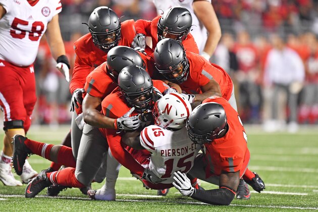 COLUMBUS, OH - NOVEMBER 5:  A gang of Ohio State Buckeyes defenders drop De'Mornay Pierson-El #15 of the Nebraska Cornhuskers for a one-yard loss in the second quarter at Ohio Stadium on November 5, 2016 in Columbus, Ohio.  (Photo by Jamie Sabau/Getty Images)