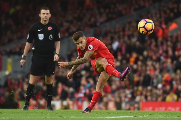 Liverpool's Brazilian midfielder Philippe Coutinho attempts a shot at goal during the English Premier League football match between Liverpool and Watford at Anfield in Liverpool, north west England on November 6, 2016. / AFP / PAUL ELLIS / RESTRICTED TO EDITORIAL USE. No use with unauthorized audio, video, data, fixture lists, club/league logos or 'live' services. Online in-match use limited to 75 images, no video emulation. No use in betting, games or single club/league/player publications.  /         (Photo credit should read PAUL ELLIS/AFP/Getty Images)