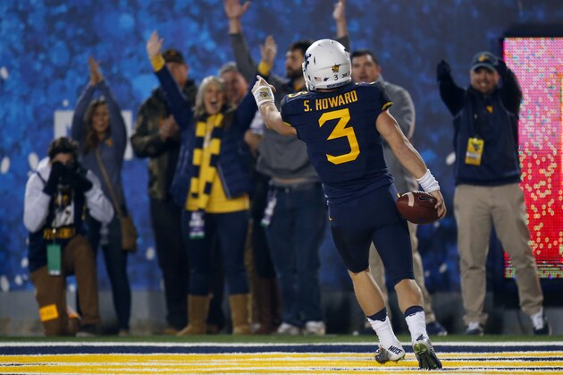 MORGANTOWN, WV - NOVEMBER 05:  Skyler Howard #3 of the West Virginia Mountaineers celebrates after rushing for a 33 yard touchdown in the first half against the Kansas Jayhawks during the game on November 5, 2016 at Mountaineer Field in Morgantown, West Virginia.  (Photo by Justin K. Aller/Getty Images)