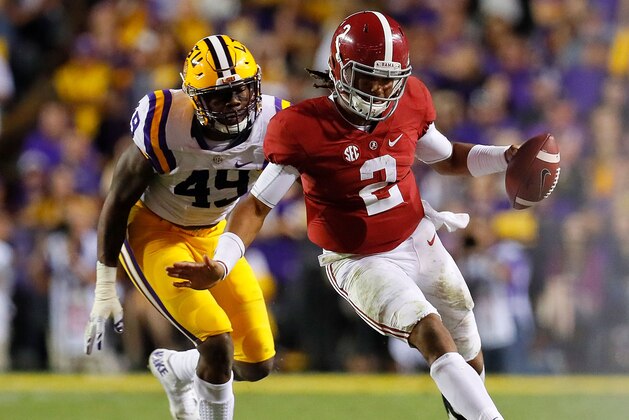 BATON ROUGE, LA - NOVEMBER 05:  Jalen Hurts #2 of the Alabama Crimson Tide rushes away from Arden Key #49 of the LSU Tigers at Tiger Stadium on November 5, 2016 in Baton Rouge, Louisiana.  (Photo by Kevin C. Cox/Getty Images)