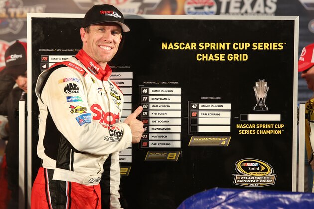 FORT WORTH, TX - NOVEMBER 06:  Carl Edwards, driver of the #19 Sport Clips Toyota, points to the Championship Round of the Chase Grid in Victory Lane after winning the rain-shortened NASCAR Sprint Cup Series AAA Texas 500 at Texas Motor Speedway on November 6, 2016 in Fort Worth, Texas.  (Photo by Jerry Markland/Getty Images)