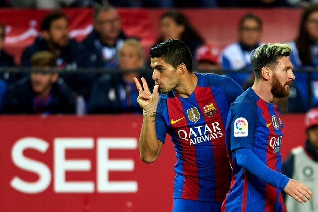 SEVILLE, SPAIN - NOVEMBER 06:  Luis Suarez of FC Barcelona  celebrates after scoring with his team mate Lionel Messi of FC Barcelona  during the match between Sevilla FC vs FC Barcelona as part of La Liga at Ramon Sanchez Pizjuan Stadium on November 6, 2016 in Seville, Spain.  (Photo by Aitor Alcalde/Getty Images)