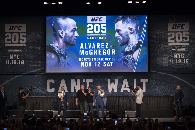 NEW YORK, NY - SEPTEMBER 27:  (L-R) UFC lightweight champion Eddie Alvarez and UFC featherweight champion Conor McGregor interact with the media and fans during the UFC 205 press event at Madison Square Garden on September 27, 2016 in New York City. (Photo by Jeff Bottari/Zuffa LLC/Zuffa LLC via Getty Images)