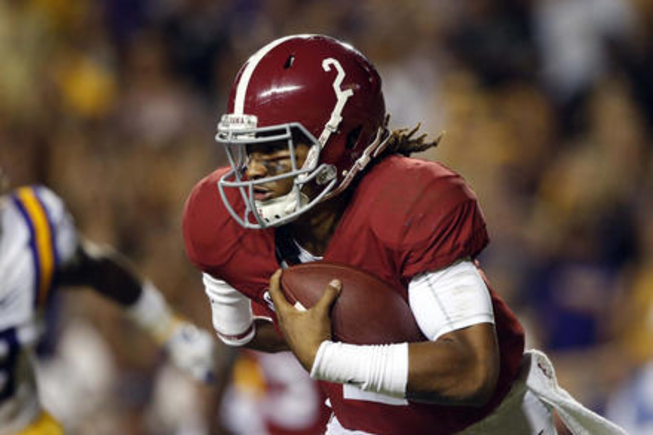 FILE - In this Saturday, Nov. 5, 2016, file photo, Alabama quarterback Jalen Hurts (2) carries in the first half of an NCAA college football game against LSU in Baton Rouge, La. At this point in the college football season, the favorites have been identified. For the third consecutive week the top six teams in The Associated Press college football poll were unchanged. (AP Photo/Gerald Herbert, File)