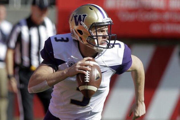 FILE - In this Saturday, Oct. 29, 2016, file photo, Washington quarterback Jake Browning (3) rolls out as he looks down field in the first half of an NCAA college football game against Utah  in Salt Lake City. Browning was solid, 186 yards passing, two touchdowns and an interception, in their victory against Utah. (AP Photo/Rick Bowmer, File)