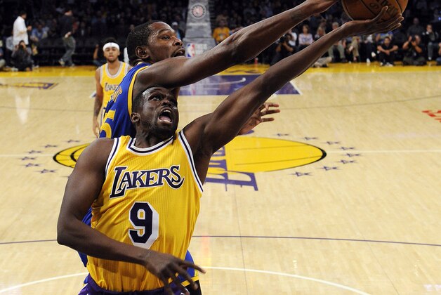 LOS ANGELES, CA - NOVEMBER 4: Kevin Durant #35 of the Golden State Warriors blocks a layup by Luol Deng #9 of the Los Angeles Lakers during the first half of the basketball game at Staples Center November 4, 2016, in Los Angeles, California. NOTE TO USER: User expressly acknowledges and agrees that, by downloading and or using this photograph, User is consenting to the terms and conditions of the Getty Images License Agreement. (Photo by Kevork Djansezian/Getty Images)