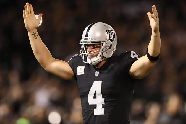 OAKLAND, CA - NOVEMBER 06:   Derek Carr #4 of the Oakland Raiders celebrates a touchdown during the second quarter against the Denver Broncos at Oakland-Alameda County Coliseum on November 6, 2016 in Oakland, California. (Photo by Ezra Shaw/Getty Images)