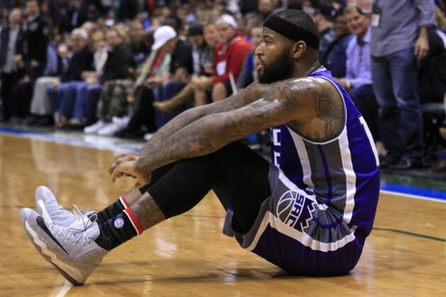 CORRECTS TO DEMARCUS COUSINS NOT TY LAWSON - Sacramento Kings' DeMarcus Cousins takes a moment after being fouled by Milwaukee Bucks forward Giannis Antetokounmpo during the first half of a NBA basketball game Saturday, Nov. 5, 2016, in Milwaukee. (AP Photo/Darren Hauck)