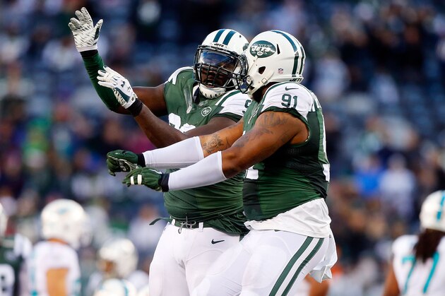 EAST RUTHERFORD, NJ - NOVEMBER 29:  (NEW YORK DAILIES OUT)     Muhammad Wilkerson #96 and  Sheldon Richardson #91 of the New York Jets in action against the Miami Dolphins on November 29, 2015 at MetLife Stadium in East Rutherford, New Jersey. The Jets defeated the Dolphins 38-20.  (Photo by Jim McIsaac/Getty Images)