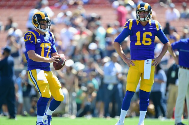 LOS ANGELES, CA - SEPTEMBER 18:  Quarterback  Case Keenum #17 (L) and Jared Goff #16 (R) of the Los Angeles Rams warm up before their home opening NFL game against the Seattle Seahawks at Los Angeles Coliseum on September 18, 2016 in Los Angeles, California.  (Photo by Harry How/Getty Images)