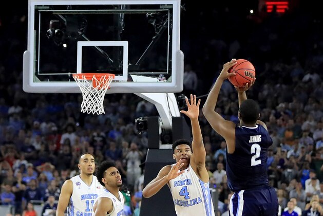 HOUSTON, TEXAS - APRIL 04:  Kris Jenkins #2 of the Villanova Wildcats shoots the game-winning three pointer to defeat the North Carolina Tar Heels 77-74 in the 2016 NCAA Men's Final Four National Championship game at NRG Stadium on April 4, 2016 in Houston, Texas.  (Photo by Ronald Martinez/Getty Images)