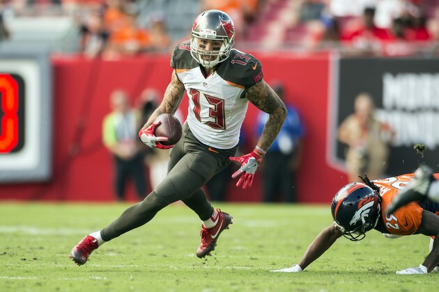 TAMPA, FL - OCTOBER 02:  Wide receiver Mike Evans #13 of the Tampa Bay Buccaneers carries the ball during a NFL game against the Denver Broncos at Raymond James Stadium on October 2, 2016 in Tampa, Florida.  (Photo by Ronald C. Modra/Sports Imagery/ Getty Images)